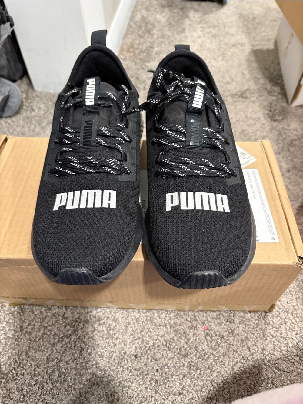 Puma Black womens Athletic Trainers with White Logo